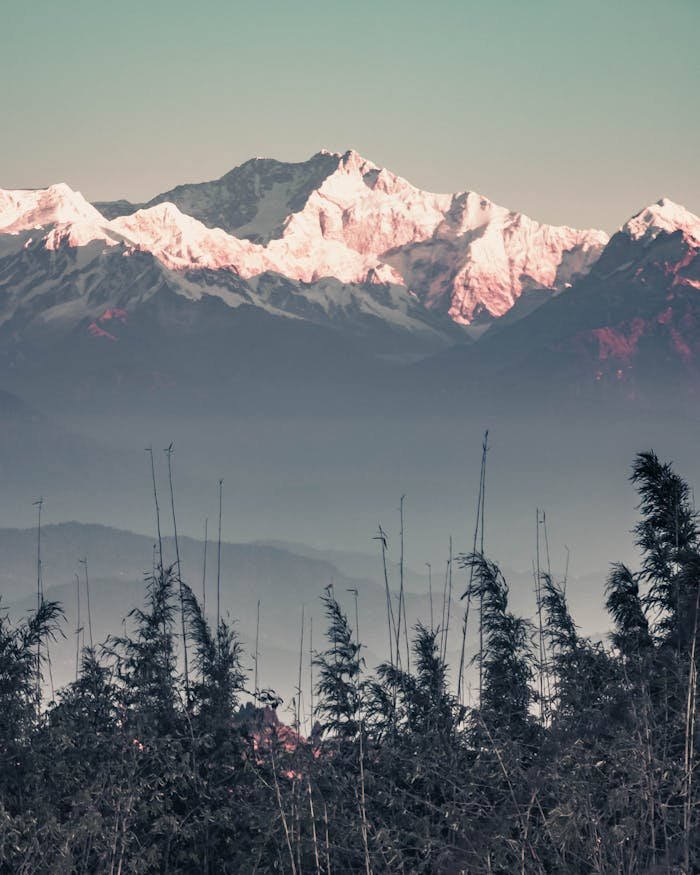 Scenic view of snow-covered Himalayan mountains at sunrise from Darjeeling, India.